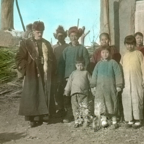 Eugen Imhof (front left) with a group of local Christians. (Place and date unknown, coloured, SMB archive, FDC 118/96)